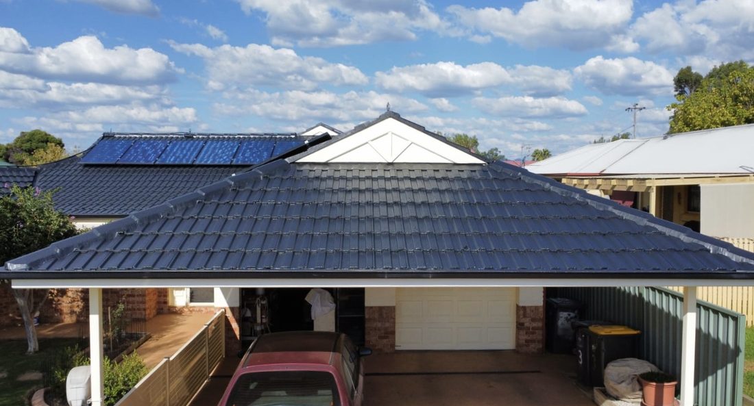 Tile roof restored to a deep charcoal