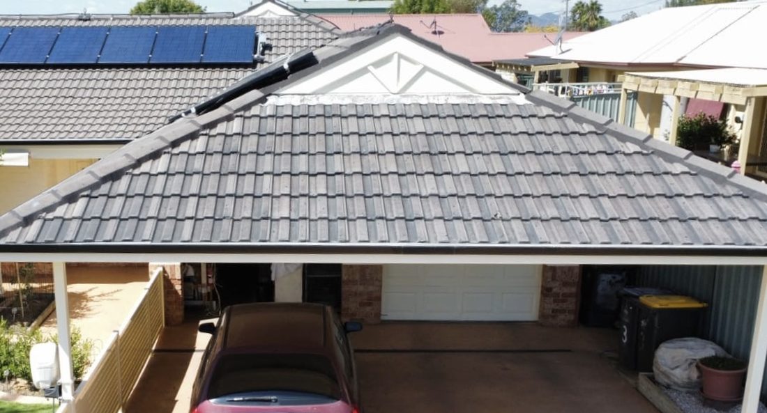 Grey tile roof before charcoal restoration