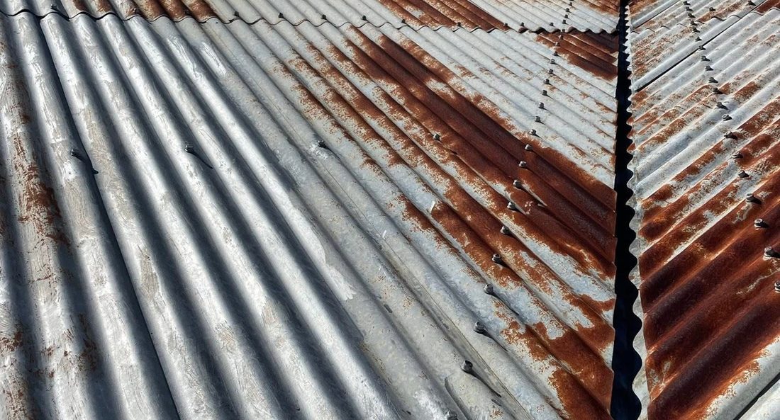 Close up of a heavily rusted corrugated iron roof
