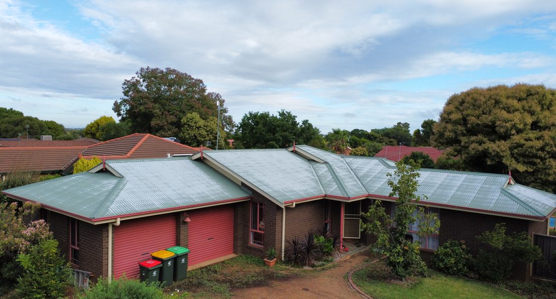 Faded chalky green roof before repaint