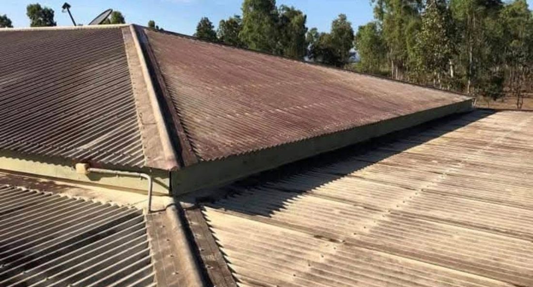 Faded brown roof before recoating